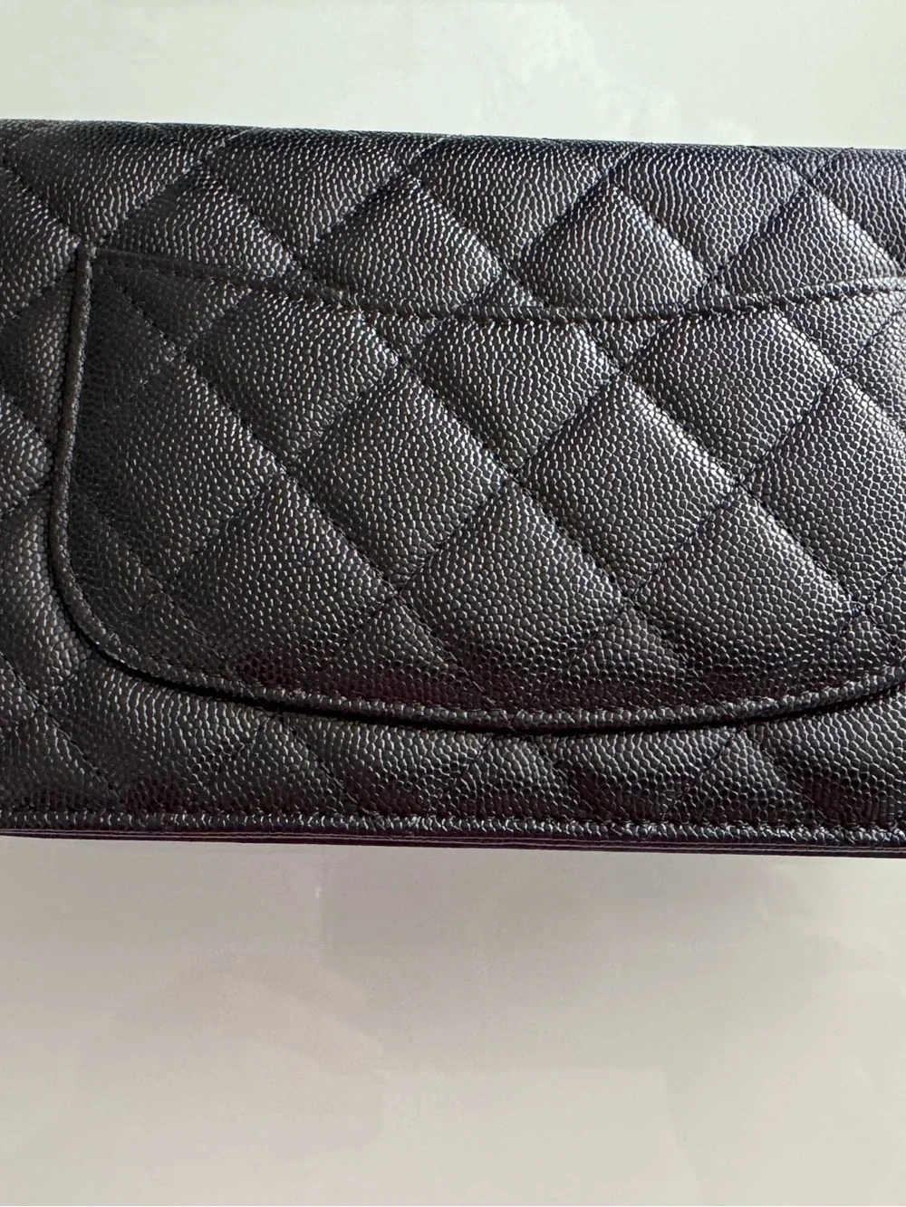 CHANEL WOC Black caviar leather with Gold Hardware and heart shaped crystal logo